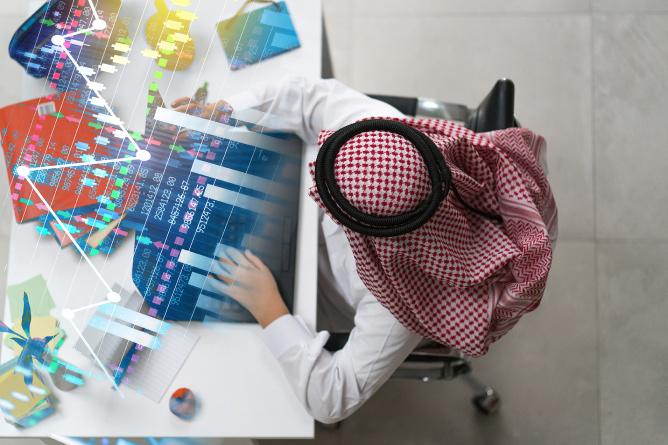 A,Young,Arab,Businessman,Working,On,Laptop,At,The,Desk